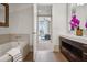 This ensuite bathroom features a bathtub, vanity, and access to the bedroom at 1820 Peachtree Nw St # 1110, Atlanta, GA 30309