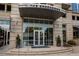 Elegant building entrance with well-maintained landscaping and inviting access for residents and guests at 1820 Peachtree Nw St # 1110, Atlanta, GA 30309