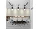 Bright conference room featuring modern lighting fixtures and a stylish table with comfortable white chairs at 1820 Peachtree Nw St # 1110, Atlanta, GA 30309