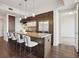 Modern kitchen with a large island, a stainless steel fridge and seating for four at 1820 Peachtree Nw St # 1110, Atlanta, GA 30309
