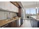 Gourmet kitchen with a granite countertop, stainless steel appliances, and city view at 1820 Peachtree Nw St # 1110, Atlanta, GA 30309