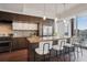 Modern kitchen with stainless steel appliances, island seating, and city view at 1820 Peachtree Nw St # 1110, Atlanta, GA 30309