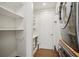 Well-organized laundry room featuring built-in shelving and modern washer and dryer for added convenience at 1820 Peachtree Nw St # 1110, Atlanta, GA 30309