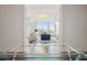 Open-concept living area with floor-to-ceiling windows and city views, viewed from home office at 1820 Peachtree Nw St # 1110, Atlanta, GA 30309