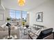 Bright living room with floor to ceiling windows and a beautiful city view at 1820 Peachtree Nw St # 1110, Atlanta, GA 30309