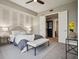 This main bedroom boasts soft decor, a ceiling fan, and a door leading to the closet, and is ready for a restful night at 1820 Peachtree Nw St # 1110, Atlanta, GA 30309