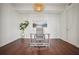 Minimalist home office featuring a modern desk, chair, and a large painting on the wall at 1820 Peachtree Nw St # 1110, Atlanta, GA 30309