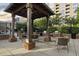 Covered outdoor grilling area featuring multiple grills, seating, and a welcoming space for community gatherings at 1820 Peachtree Nw St # 1110, Atlanta, GA 30309