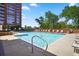 Inviting outdoor pool with lounge chairs, set against the backdrop of the building and mature trees at 1820 Peachtree Nw St # 1110, Atlanta, GA 30309