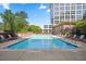 Refreshing outdoor pool surrounded by lounge chairs, showcasing a perfect spot for relaxation and leisure at 1820 Peachtree Nw St # 1110, Atlanta, GA 30309