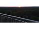 Breathtaking sunset view from the balcony overlooking lush greenery, providing a serene escape at 1820 Peachtree Nw St # 1110, Atlanta, GA 30309