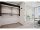 This walk-in closet provides additional storage space with convenient access to hanging rods and is filled with natural light at 1820 Peachtree Nw St # 1110, Atlanta, GA 30309