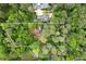 A peaceful aerial view of the property's wooded lot at 1909 Moores Mill Nw Rd, Atlanta, GA 30318