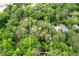 Aerial view of a wooded home site with mature trees, showcasing a peaceful and secluded setting in a green neighborhood at 1909 Moores Mill Nw Rd, Atlanta, GA 30318