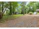 Expansive backyard featuring a detached garage and lush greenery for outdoor enjoyment at 1909 Moores Mill Nw Rd, Atlanta, GA 30318