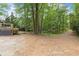 View of backyard with gravel parking at 1909 Moores Mill Nw Rd, Atlanta, GA 30318