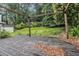 Relax and enjoy the privacy of the backyard with a wooden deck surrounded by lush greenery at 1909 Moores Mill Nw Rd, Atlanta, GA 30318