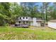 Spacious backyard with a deck, outdoor furniture, and a shed at 1909 Moores Mill Nw Rd, Atlanta, GA 30318