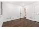 Hardwood floors, white walls, base board trim, doors and windows in this large bedroom at 1909 Moores Mill Nw Rd, Atlanta, GA 30318