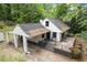 Charming home featuring a carport, deck, and well-maintained exterior at 1909 Moores Mill Nw Rd, Atlanta, GA 30318