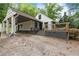 Exterior elevation showcasing carport and deck at 1909 Moores Mill Nw Rd, Atlanta, GA 30318