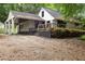 Exterior of home with covered carport, deck, and private yard at 1909 Moores Mill Nw Rd, Atlanta, GA 30318