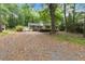 A quaint exterior with a covered carport and a shed on a spacious lot at 1909 Moores Mill Nw Rd, Atlanta, GA 30318