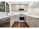 Bright kitchen showcasing updated appliances, and countertops, with hardwood floors at 1909 Moores Mill Nw Rd, Atlanta, GA 30318