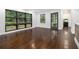Bright living room featuring large windows, dark trim, and hardwood floors at 1909 Moores Mill Nw Rd, Atlanta, GA 30318