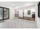 Open concept living area with designer tile floor, wood floors, access to the backyard and recessed lighting at 1909 Moores Mill Nw Rd, Atlanta, GA 30318