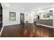 Inviting living room open to kitchen boasts hardwood floors and large windows at 1909 Moores Mill Nw Rd, Atlanta, GA 30318