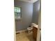 Functional bathroom with a vanity, toilet, and a window for natural light at 2037 Lakewood Trl Se, Atlanta, GA 30315