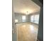 Bright dining room with tile floors and multiple windows providing ample natural light at 2037 Lakewood Trl Se, Atlanta, GA 30315