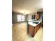 Eat-in kitchen next to dining room and featuring wood cabinets and a breakfast bar at 2037 Lakewood Trl Se, Atlanta, GA 30315