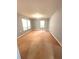 Spacious living room featuring multiple windows for natural light and neutral wall color at 2037 Lakewood Trl Se, Atlanta, GA 30315