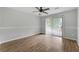 Bedroom featuring hardwood floors, ceiling fan, and sliding glass door at 2638 Stoney Creek Rd, Marietta, GA 30067