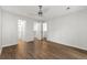 Well-lit bedroom featuring hardwood floors, a ceiling fan, and closet access at 2638 Stoney Creek Rd, Marietta, GA 30067