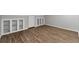 Bonus room with hardwood floors, white shelving and storage closet at 2638 Stoney Creek Rd, Marietta, GA 30067
