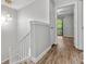 Second floor hallway featuring hardwood floors and natural light at 2638 Stoney Creek Rd, Marietta, GA 30067
