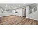 Bright living room with hardwood floors, large mirror and staircase access at 2638 Stoney Creek Rd, Marietta, GA 30067