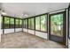 Enclosed sunroom with tile flooring and large glass windows for natural light at 2638 Stoney Creek Rd, Marietta, GA 30067