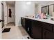 Bathroom featuring double sinks and dark cabinetry at 3241 Alhambra Cir, Hampton, GA 30228