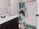 Bathroom featuring a vanity with dark wood cabinets and a shower/tub combination at 3241 Alhambra Cir, Hampton, GA 30228