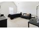 Spacious bedroom features vaulted ceiling, bed, sofa, and ample natural light at 3241 Alhambra Cir, Hampton, GA 30228