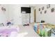 Bright bedroom with two twin beds, toy storage and ample natural light at 3241 Alhambra Cir, Hampton, GA 30228