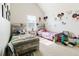 Bright bedroom with two twin beds, colorful decor, and a large window at 3241 Alhambra Cir, Hampton, GA 30228