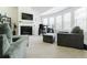 Bright living room featuring a fireplace, a TV and large windows at 3241 Alhambra Cir, Hampton, GA 30228