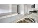 Close up of a sink with a view of the kitchen featuring granite countertops and an island at 967 Park Place St, Social Circle, GA 30025