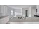 Modern kitchen featuring stainless appliances, white cabinets, and expansive countertops at 967 Park Place St, Social Circle, GA 30025