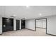 Spacious basement area with built-in shelving and storage, providing ample room for various activities at 1045 River Pt, Suwanee, GA 30024